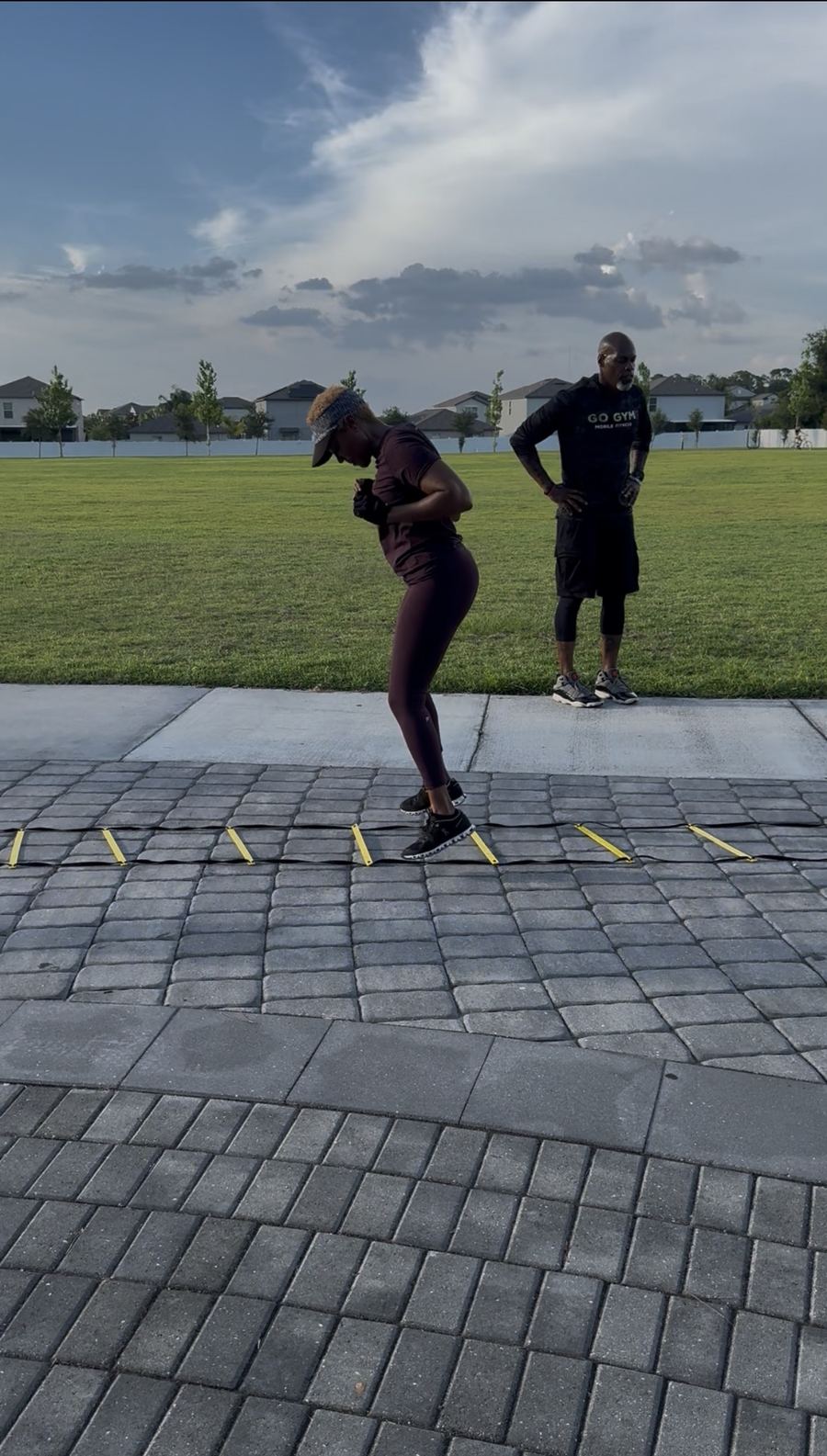 Coach Jerry coaching agility footwork outdoors