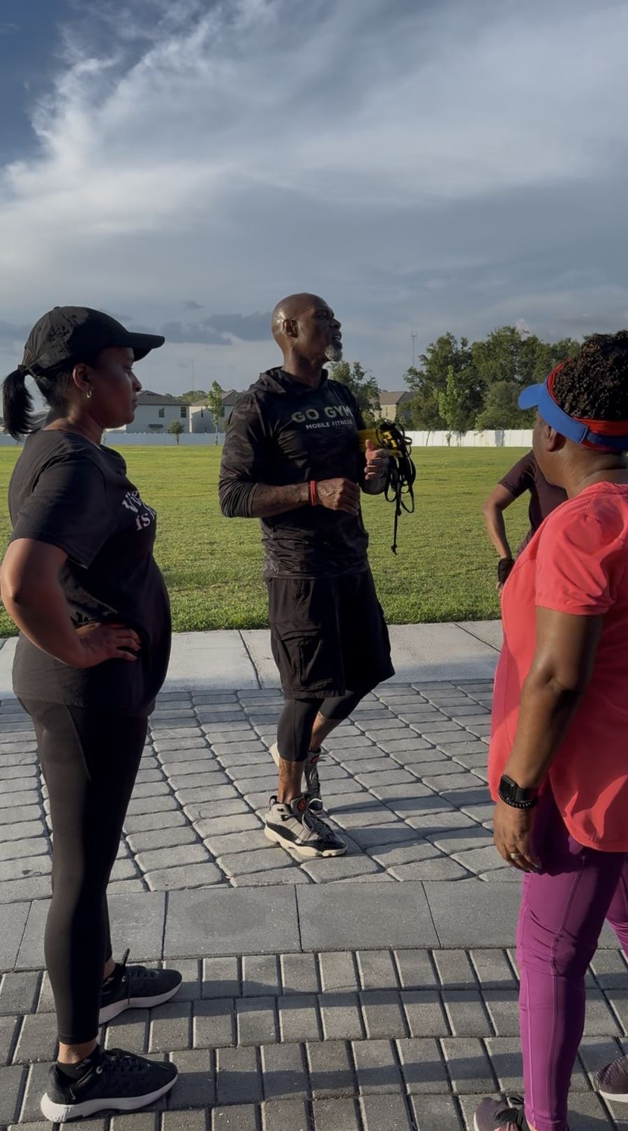 Coach Jerry talking with clients during a GO GYM! session