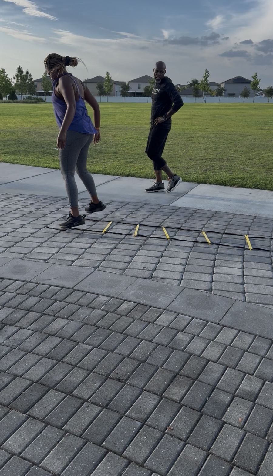 Coach Jerry coaching a client through footwork drills